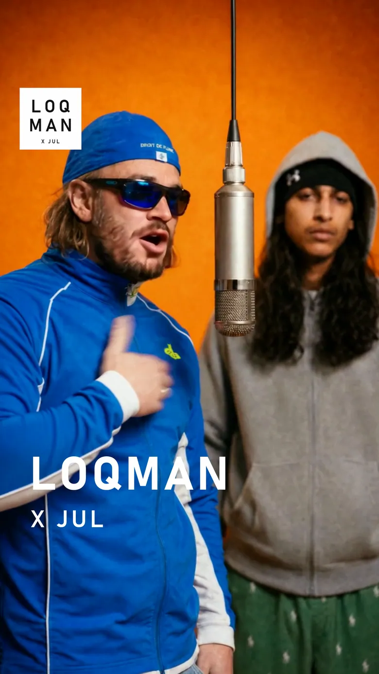 Image du montage à 5,6 secondes : Jul au premier plan, Loqman flou derrière le micro, et le titre « LOQMAN / X JUL » posé en bas à gauche.